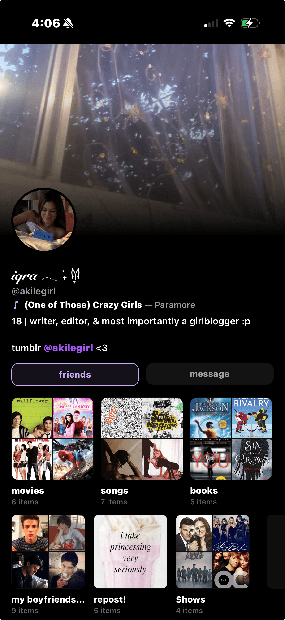 Iqra's Sharespot profile with a window and fairy lights header, portrait avatar, and shelves of movies, songs, and books.