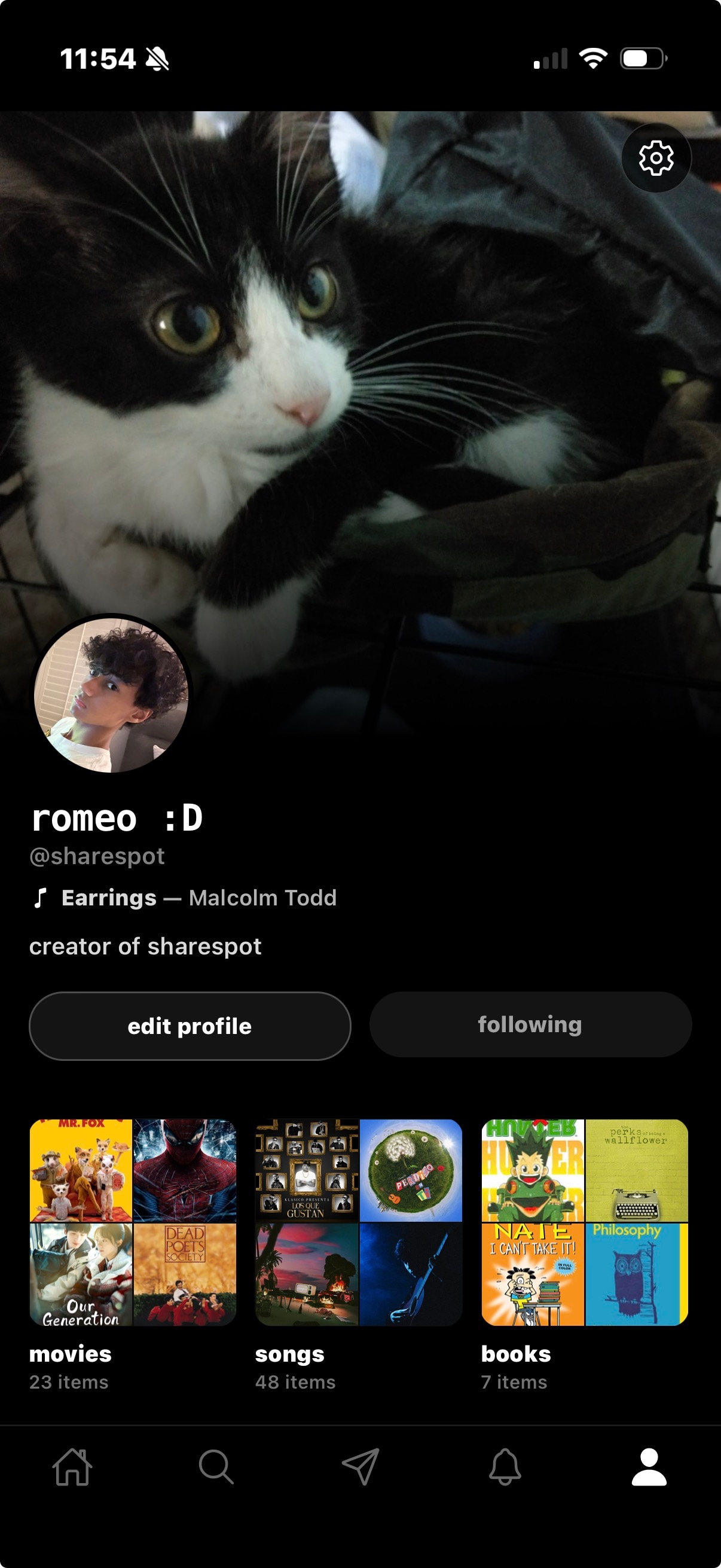 Romeo's Sharespot profile — cat header, romeo :D, Earrings — Malcolm Todd pinned, shelves of movies, songs, and books.